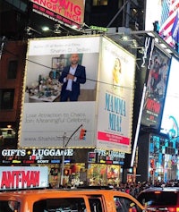 a billboard in times square with a man on it